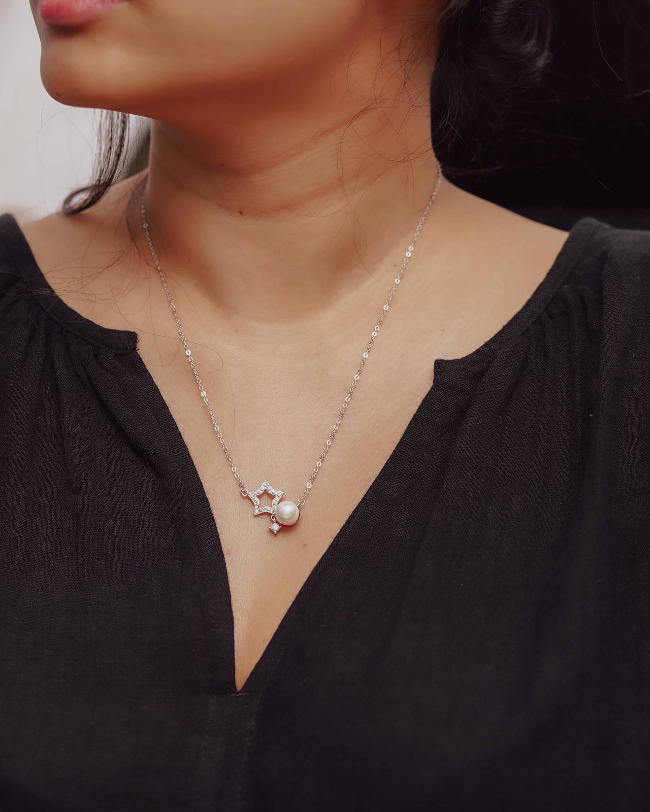 Timeless Elegance: Zircon Star with Pearl Necklace